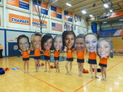 Cheerleaders show off their Big Heads created by Shindigz at Pep Rally